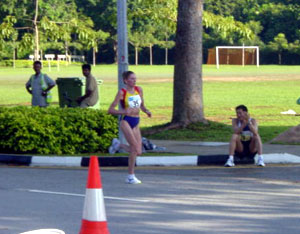 The first lady came through the 35km mark about 15mins after the men, around 2hrs12min or so. She went on to win the marathon in a Singapore record breaking time.