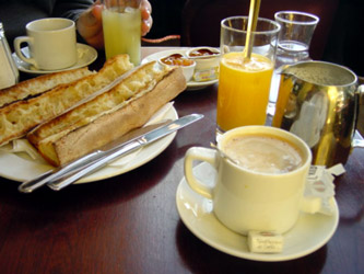 Toasted baguette, apricot jam, butter, cafe au lait and freshly squeezed orange juice. Mmm.