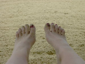 Sandy toes.